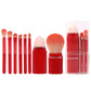 Retractable mini makeup brush set with red handles and blush/face brush in clear case