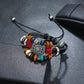 Beaded leather bracelet with circular silver charm, blue red beads, wood beads and rings