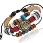 Beaded leather bracelet with circular bronze-gold charm, red blue and teal beads, tube accents