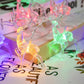 Elk string lights with multicolor glowing LED elk figures on clear wire.