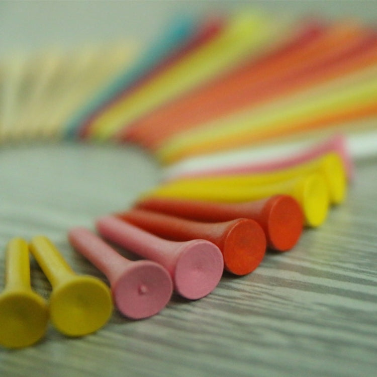 Assorted golf wooden ball tees in a row, colorful pointed tips