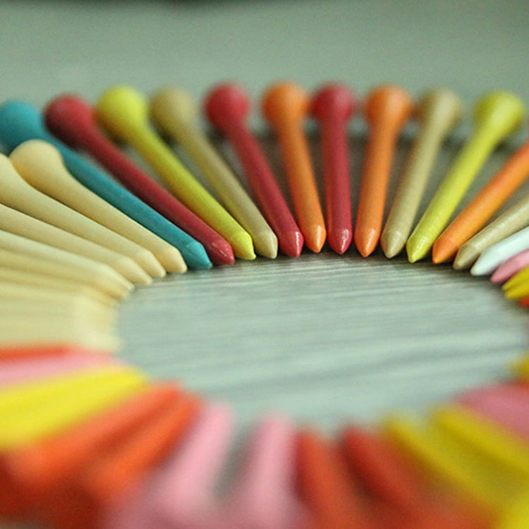Curved row of golf wooden ball tees in mixed colors