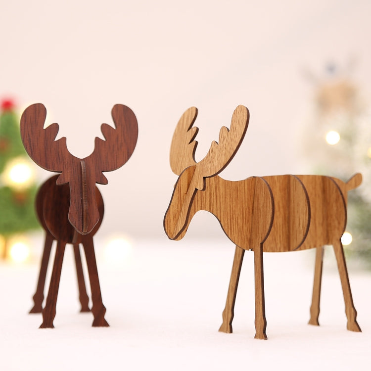 Two wooden elk desktop decorations, light and dark wood tones, standing cutouts