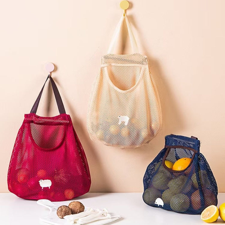 Set of wall-hanging mesh produce storage bags in red, yellow, and blue