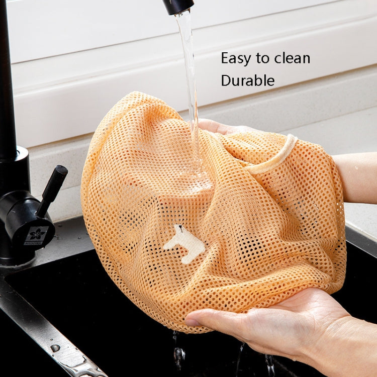 Orange mesh wall-hanging produce bag being rinsed with water for easy cleaning