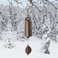 Bronze metal wind chime with cylindrical body and leaf clapper
