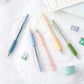Set of color utility knife pens with clear sleeves and exposed blades for paper cutting