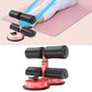Red and black sit-up aid with dual suction bases and padded ankle supports