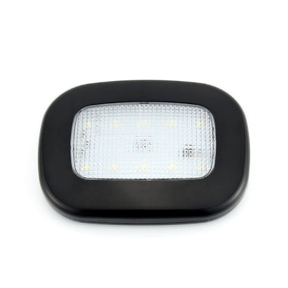 Black dome LED trunk light with clear front panel and white illumination