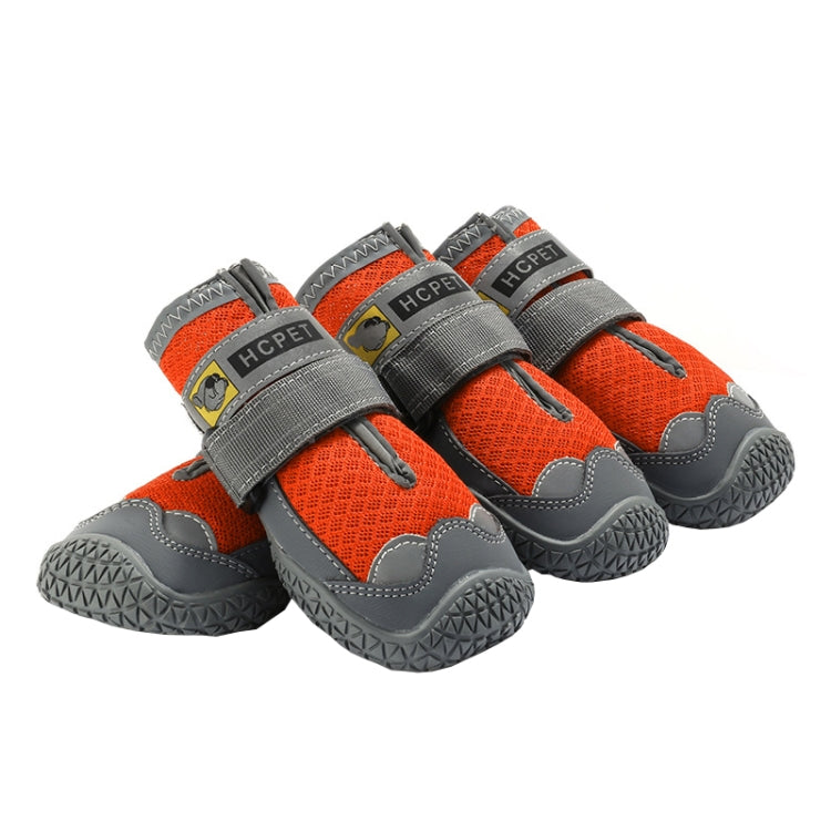 Orange mesh dog shoes with hook-and-loop straps and gray rubber tread soles, 4-pack.