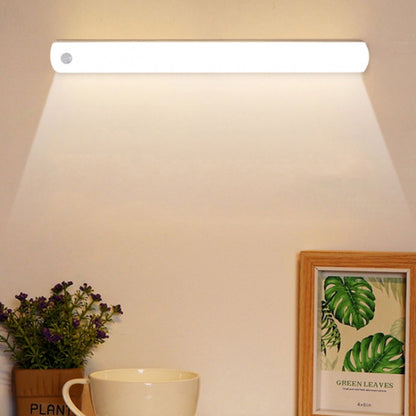 Rechargeable LED cabinet light bar with slim white housing, unlit under a shelf