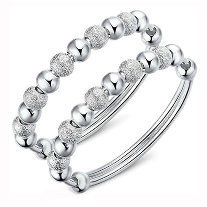Silver-tone beaded bracelet set with glitter round beads and smooth ball links