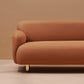 Upholstered sofa with stainless steel support legs, visible front base and foot