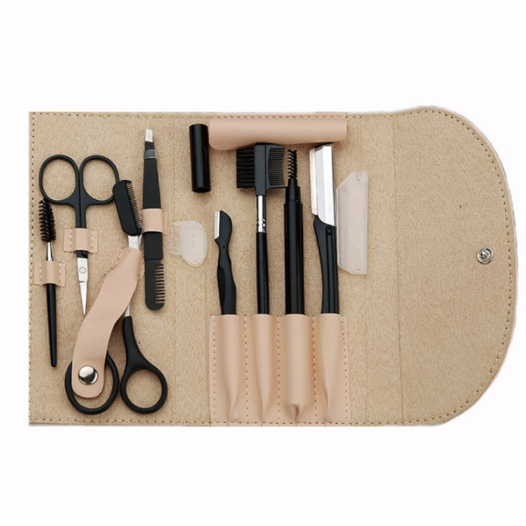 Khaki eyebrow trimming tool set in open roll pouch with scissors, combs, and trimmers