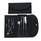 Black eyebrow trimming tool set in open roll pouch with scissors, combs, and trimmers