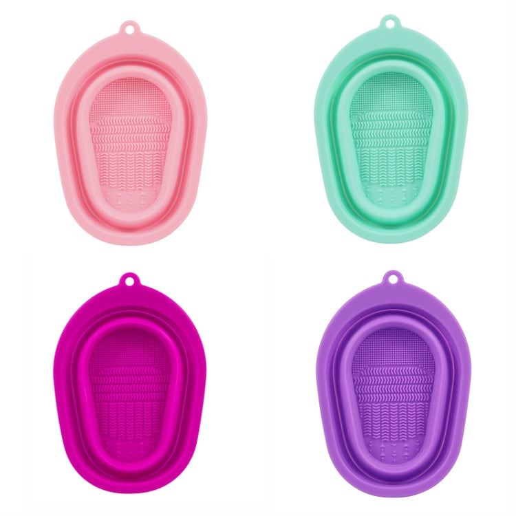Silicone makeup brush cleaning pads set in four colors: pink, teal, magenta, and purple.