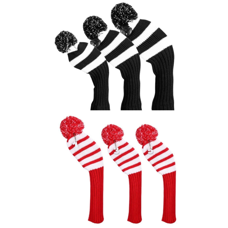 Black and white and red and white striped knitted golf club covers with pom-poms