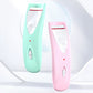 Pair of heated eyelash curlers, mint and pink, with open oval heating plate
