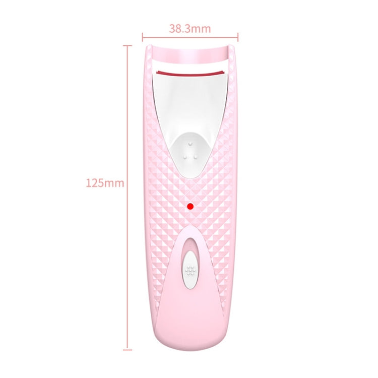 Pink heated eyelash curler with oval heating plate and red measurement lines