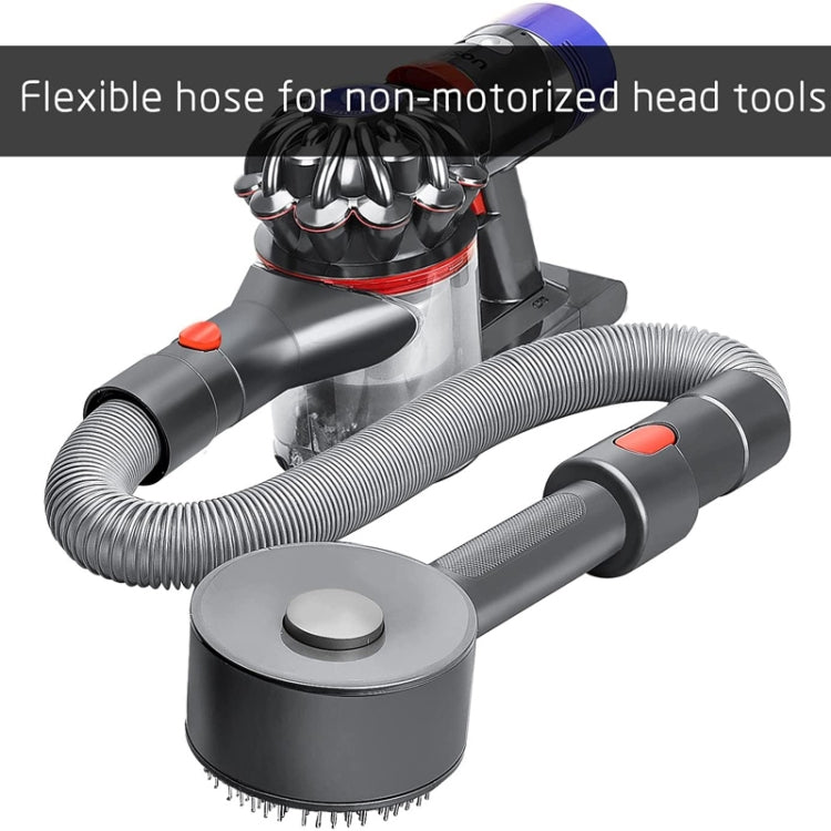 Flexible vacuum hose connected to a round bristle brush head tool