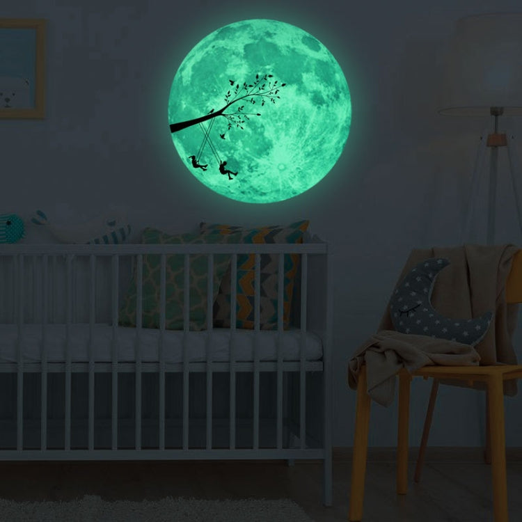 Glowing green moon wall sticker with branch silhouette and small flying figures