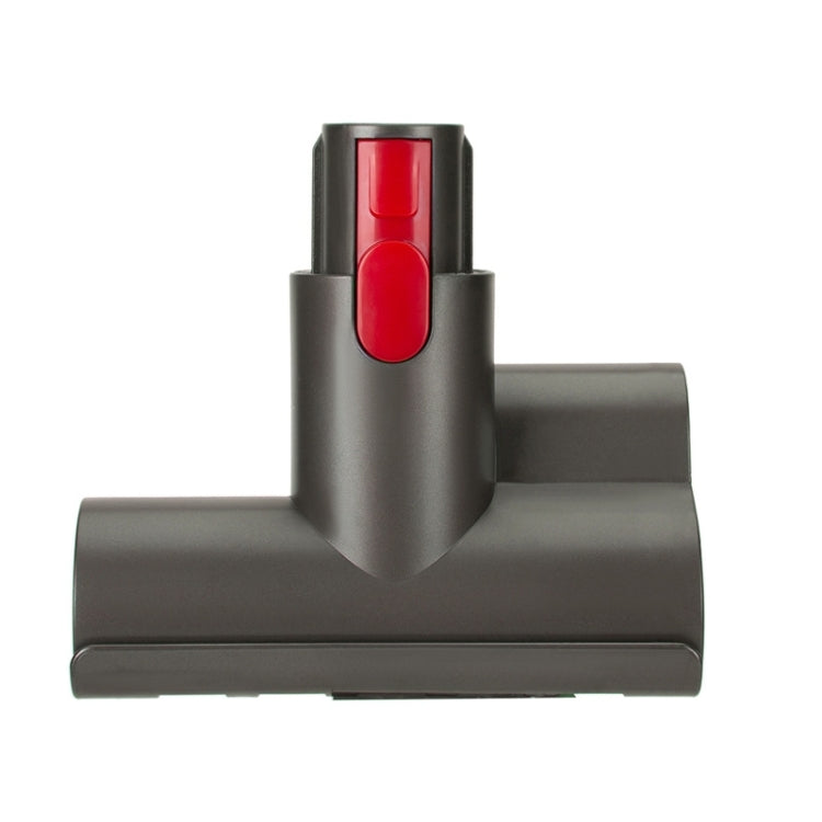 Dark gray vacuum nozzle attachment with raised red button and side air holes
