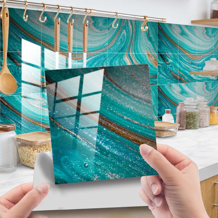 Hands applying teal marble geometric PVC tile wall stickers to a shower wall