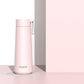 Light pink stainless steel portable thermos cup with carry loop and flip-top lid