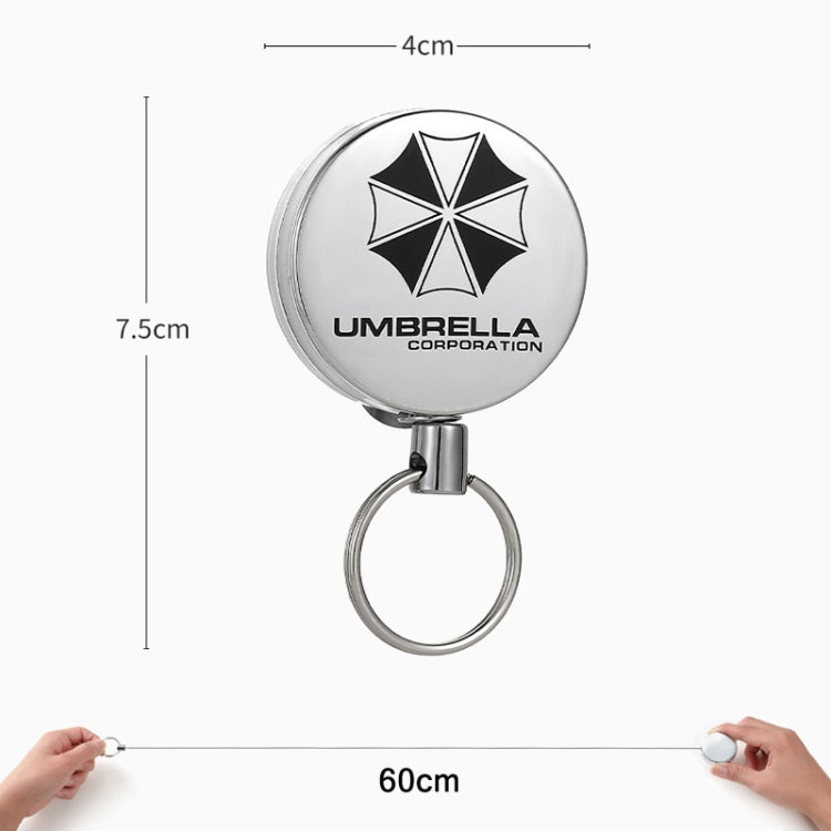 Retractable key ring with silver round case and metal key loop, size shown