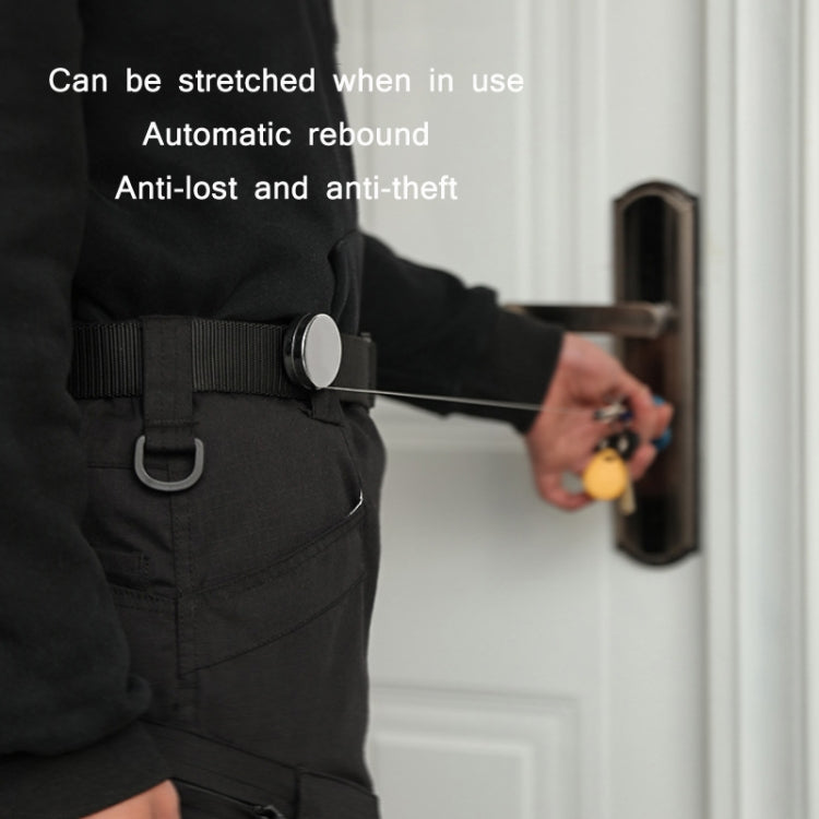 Retractable key ring clipped to a belt loop with silver retractor and key ring