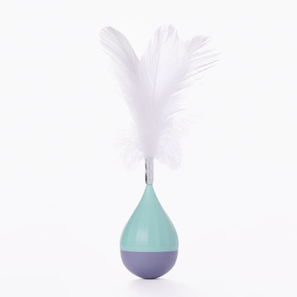 Feather tumbler cat toy with white feathers and teal-and-dark gray base
