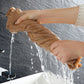 Brown coral fleece bath towel being wrung, showing water dripping from fabric
