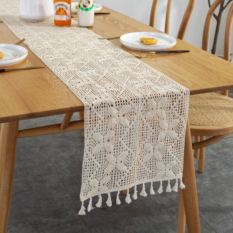 Cream rustic knitted hollow tablecloth with repeating lace motifs and tassels