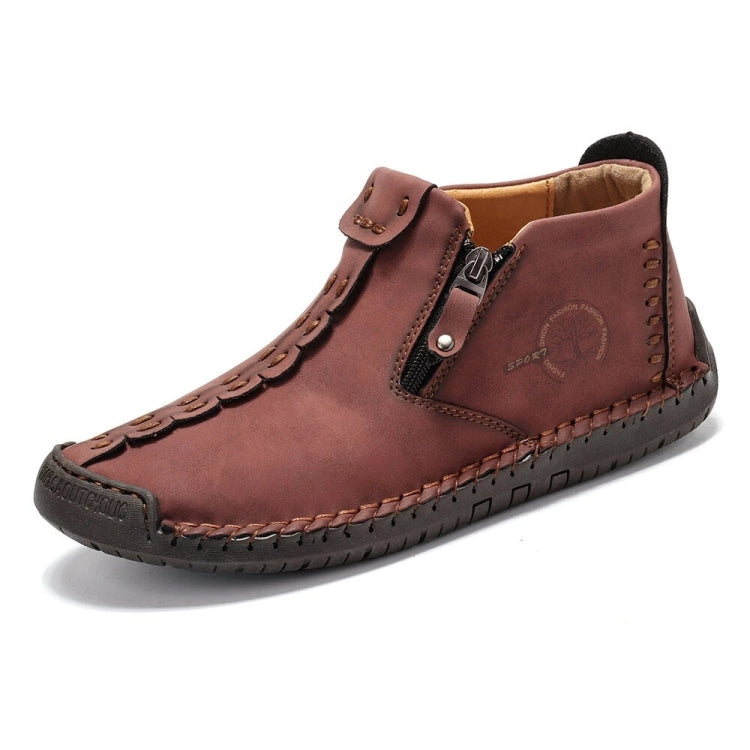 Men's burgundy ankle boots with side zipper, buckle strap, and decorative stitching