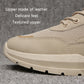Beige lace-up running shoes with textured upper and cushioned sole