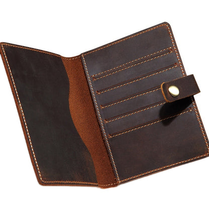Vintage leather passport card holder open, with card slots and stitched flap closure