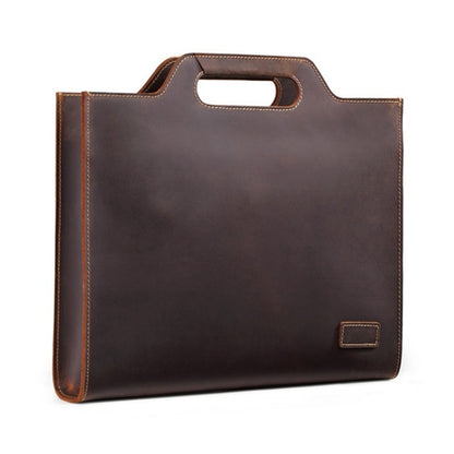 Dark brown leather business briefcase bag with top handle and front pocket.