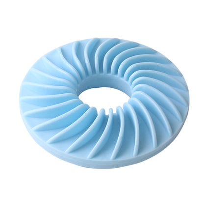 Round dog food puzzle toy in blue with ridged donut design and center hole