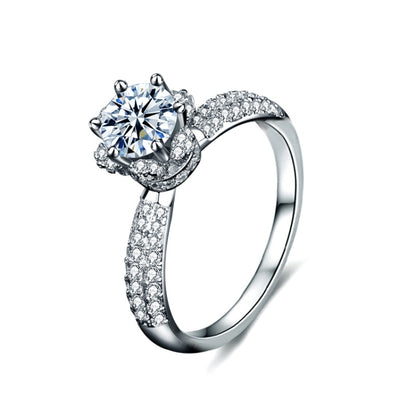 Sterling silver moissanite engagement ring with crown-style halo and pavé band