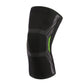 Black knit knee pad with gray support panels and neon green accent stripe.