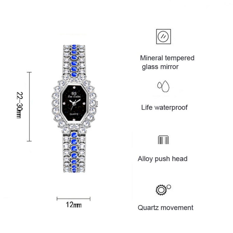 Silver rhinestone women’s quartz watch with dark face, blue side accents, push head