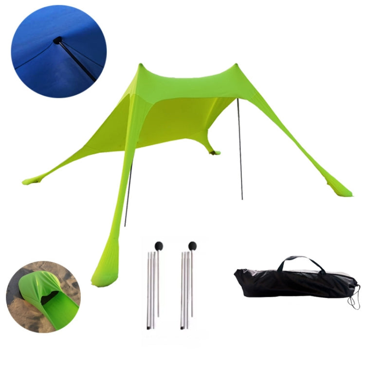 Green beach sunshade tent with mesh canopy, stakes, and carry bag
