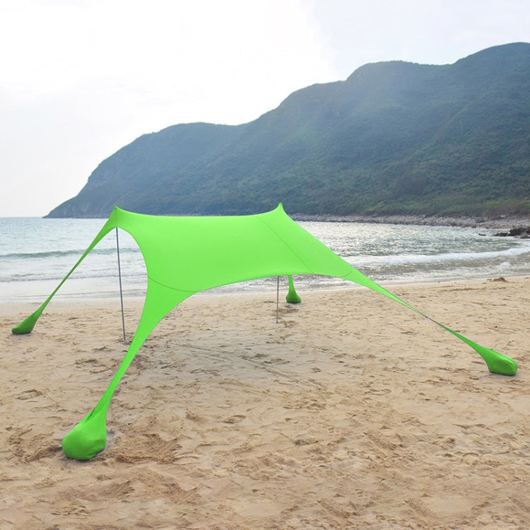 Outdoor beach sunshade canopy tent with green fabric stretched on corner poles