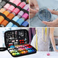 Colorful thread spools with needle assortment wheel and small sewing tools