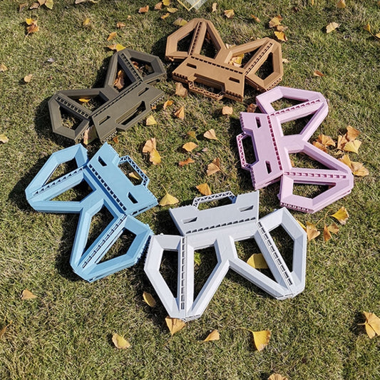 Set of folding plastic stools in pink, blue, gray, and white