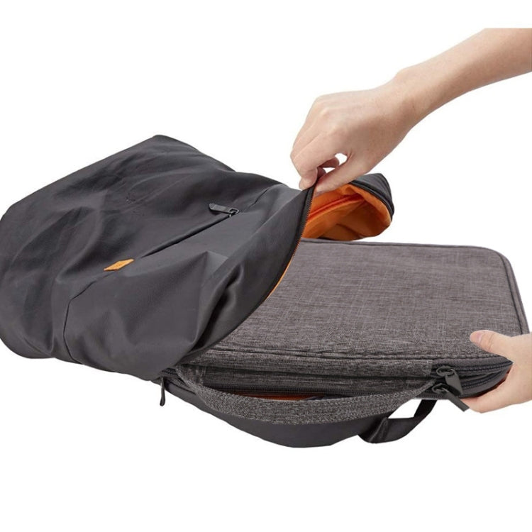 Gray watch storage bag with orange-lined interior and zippered compartments