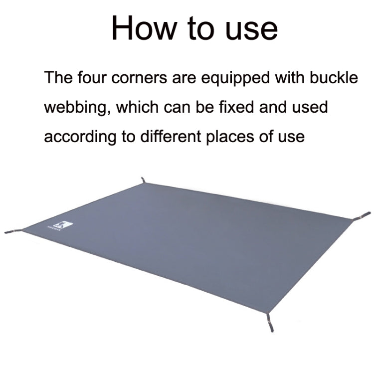 Dark blue waterproof picnic ground mat laid flat with corner stakes