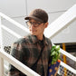 Short-brim peaked cap in dark brown, curved brim and low-profile crown