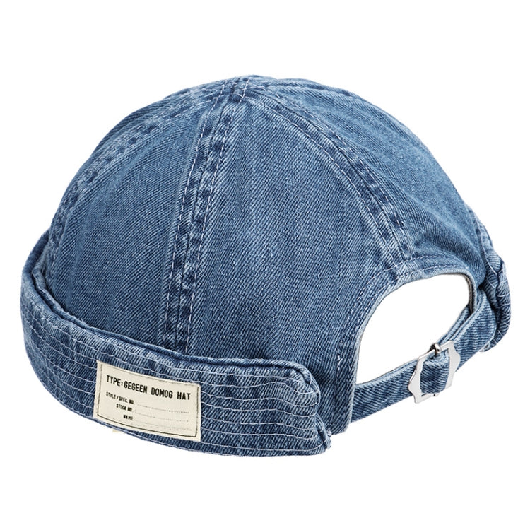 Denim blue denim cap with back opening, curved brim, and fabric label patch