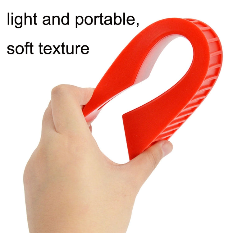 Orange-red silicone barbell protective gasket held in hand